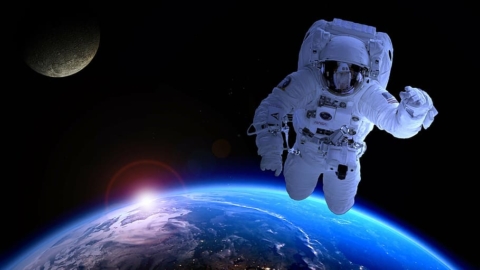 astronaut floating in space above the Earth