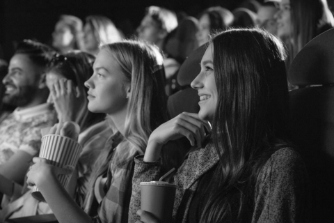 people enjoying snacks and drinks in movie theater