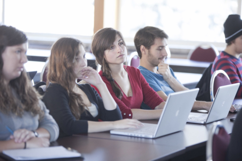 Students in a classroom on their laptops